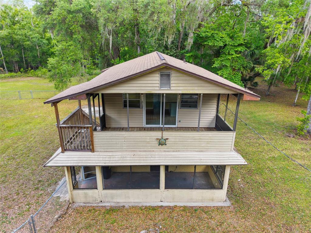 2780 County Road 575 Bushnell, FL 33513 - Photo 31 of 57 a front view of a house with balcony
