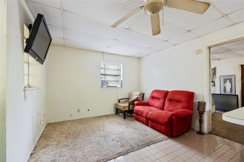 2780 County Road 575 Bushnell, FL 33513 - Photo 32 of 57 a living room with furniture and a flat screen tv