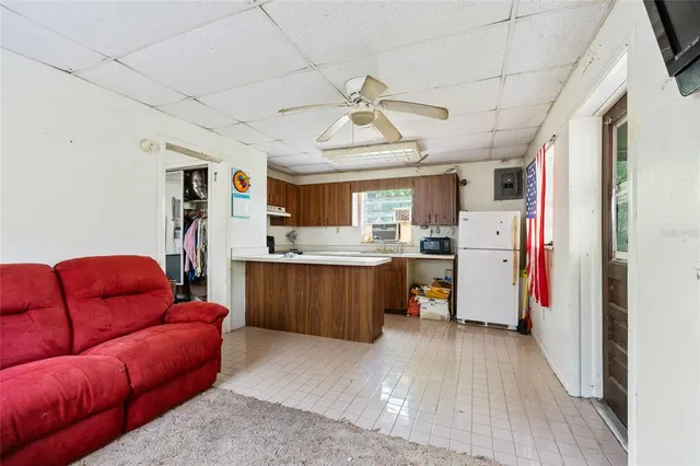 a bedroom with a bed dresser and a window