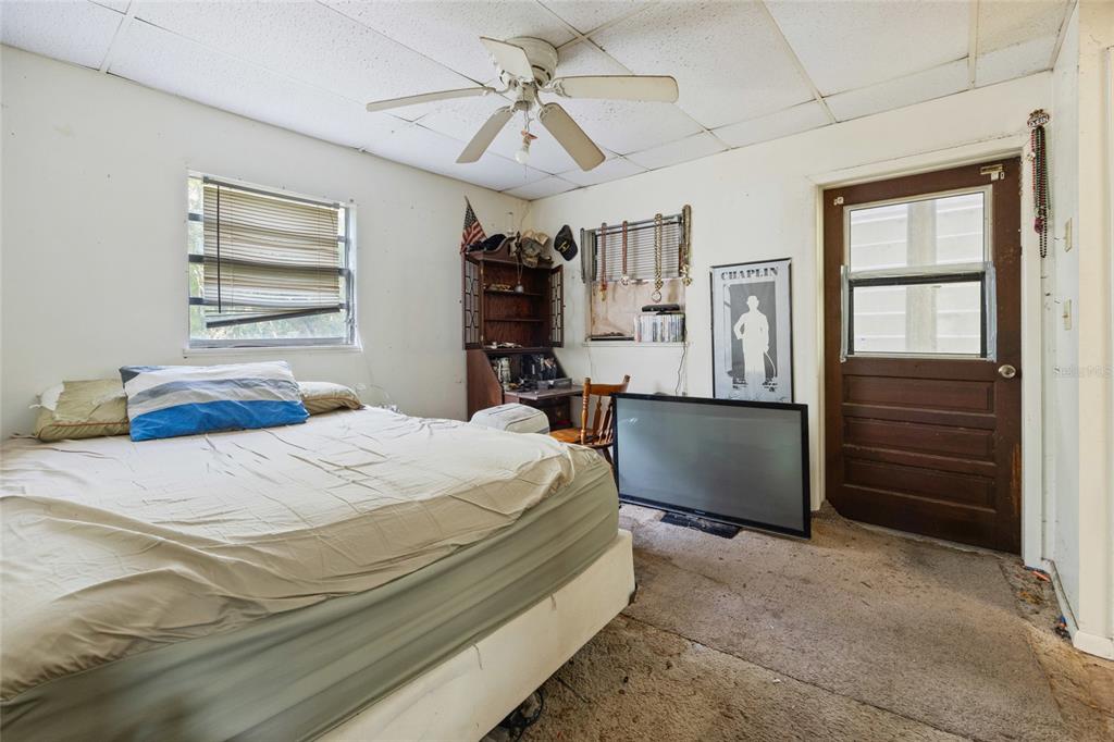 2780 County Road 575 Bushnell, FL 33513 - Photo 35 of 57 a bedroom with a bed dresser and a window