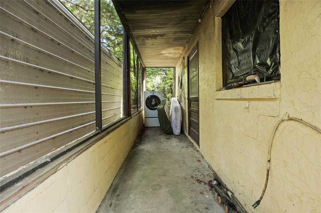 2780 County Road 575 Bushnell, FL 33513 - Photo 37 of 57 a view of a balcony with wooden floor and stairs