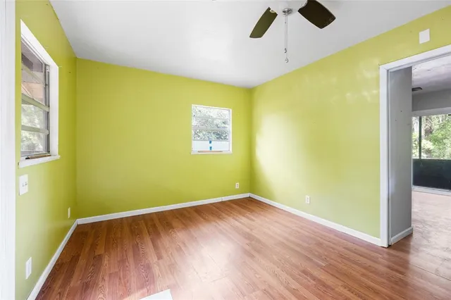 a large white kitchen with a stove top oven a sink and dishwasher
