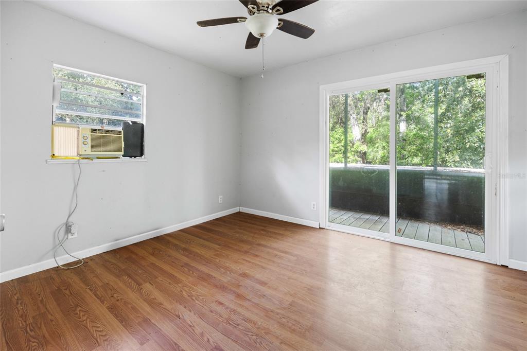 2780 County Road 575 Bushnell, FL 33513 - Photo 41 of 57 a view of an empty room with wooden floor and a window