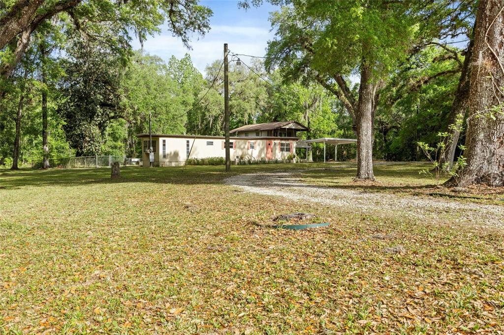 2780 County Road 575 Bushnell, FL 33513 - Photo 48 of 57 a front view of a house with a yard
