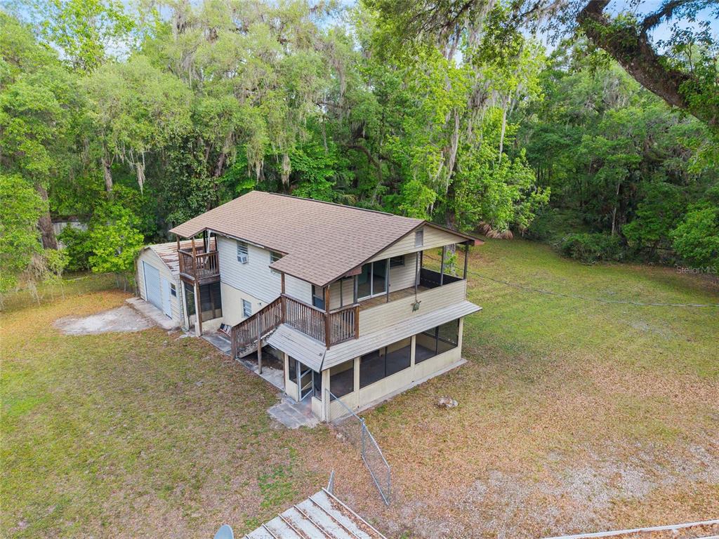 2780 County Road 575 Bushnell, FL 33513 - Photo 49 of 57 an aerial view of a house with a yard