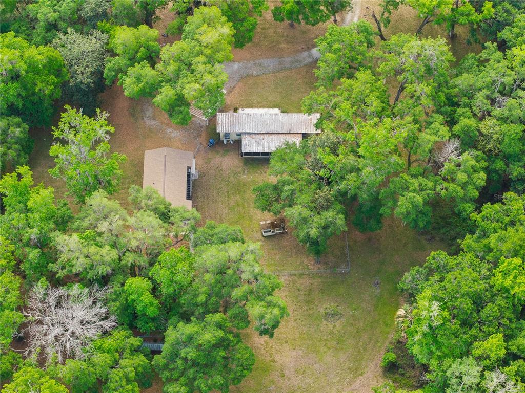 2780 County Road 575 Bushnell, FL 33513 - Photo 54 of 57 an aerial view of a house with a yard