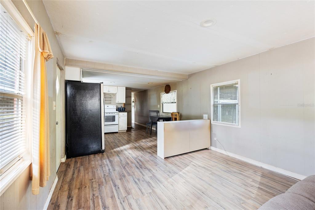 2780 County Road 575 Bushnell, FL 33513 - Photo 6 of 57 a living room with furniture and a wooden floor
