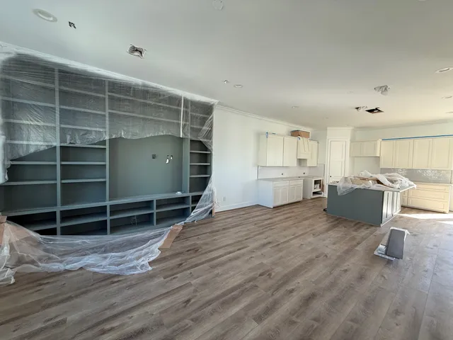 a view of a kitchen with a sink and cabinets