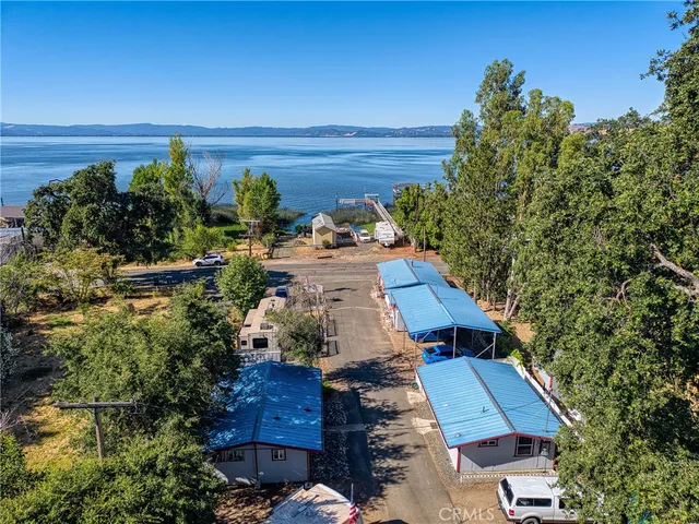 an aerial view of a houses with a yard