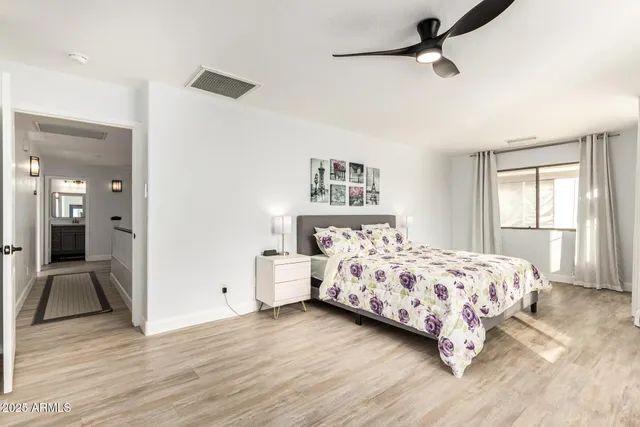 a bedroom with a bed and a window