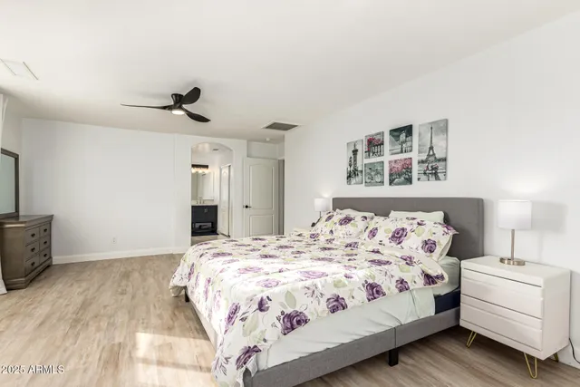 a bedroom with a large bed and a window