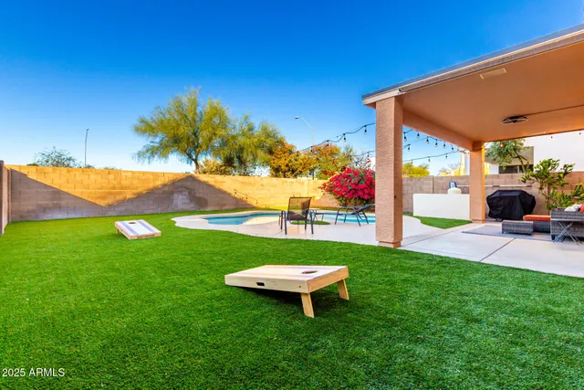 a view of a backyard with a garden and plants