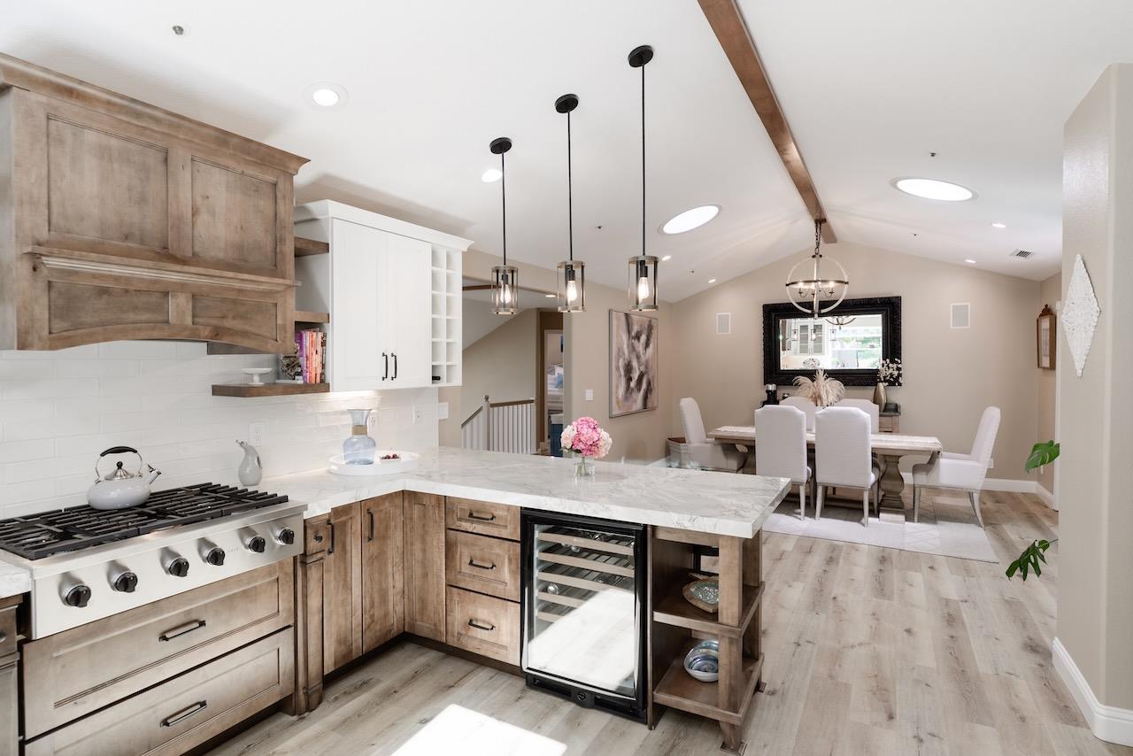 307 Sidesaddle Circle Scotts Valley, CA 95066 - Photo 17 of 116 a large kitchen with stainless steel appliances kitchen island granite countertop a stove a sink a refrigerator and a wooden floors
