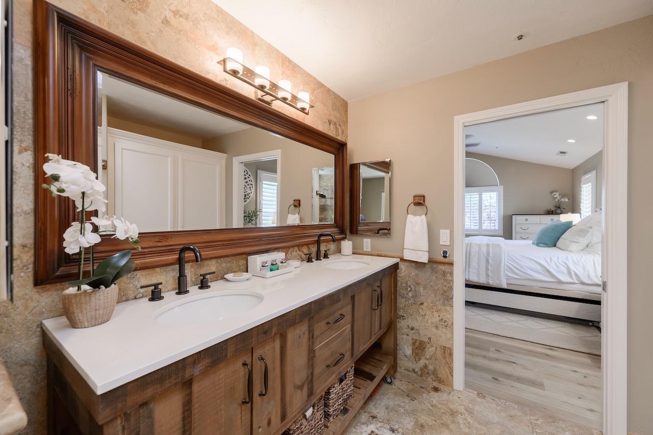 307 Sidesaddle Circle Scotts Valley, CA 95066 - Photo 47 of 116 a en suite bathroom with a double vanity sink and a mirror