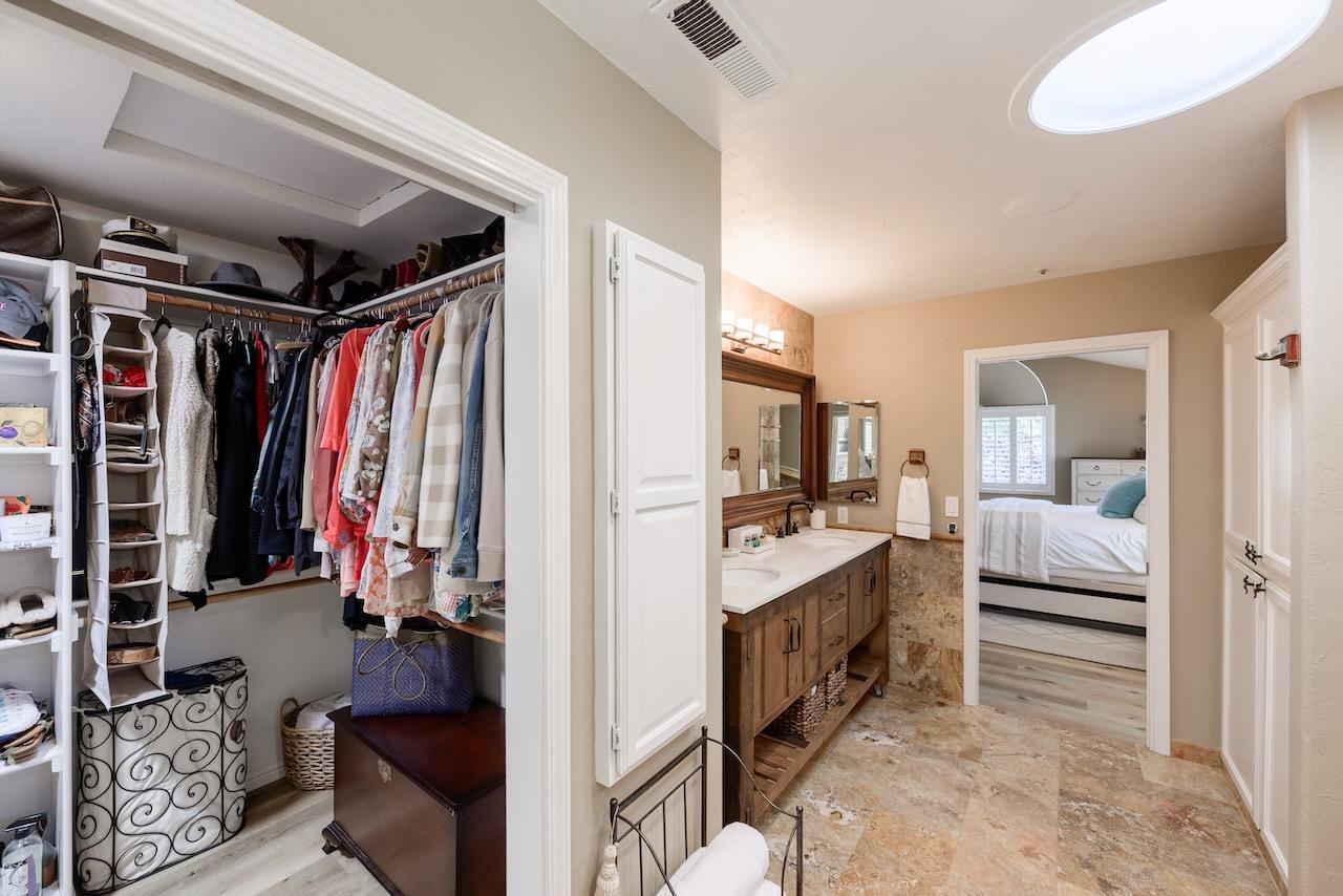 307 Sidesaddle Circle Scotts Valley, CA 95066 - Photo 54 of 116 a view of walk in closet with clothes and shoes