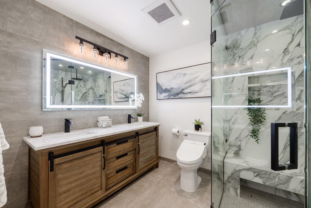 307 Sidesaddle Circle Scotts Valley, CA 95066 - Photo 74 of 116 a bathroom with a toilet a sink and a mirror