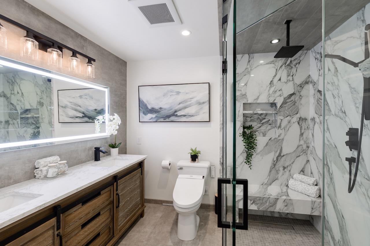 307 Sidesaddle Circle Scotts Valley, CA 95066 - Photo 77 of 116 a bathroom with a double vanity sink toilet and a mirror