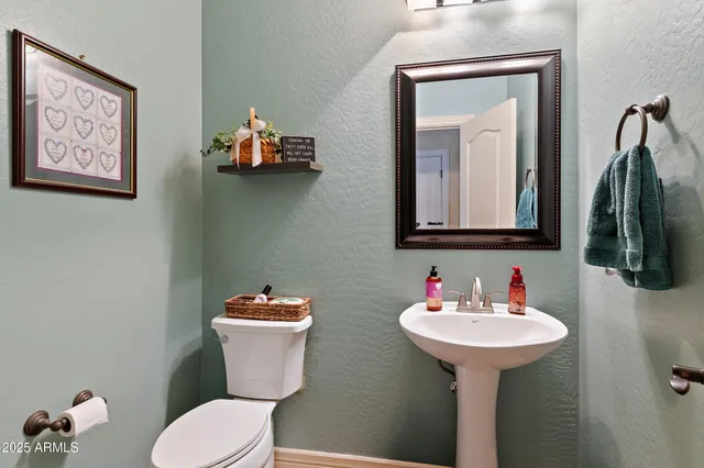 a living room with furniture and a dining table