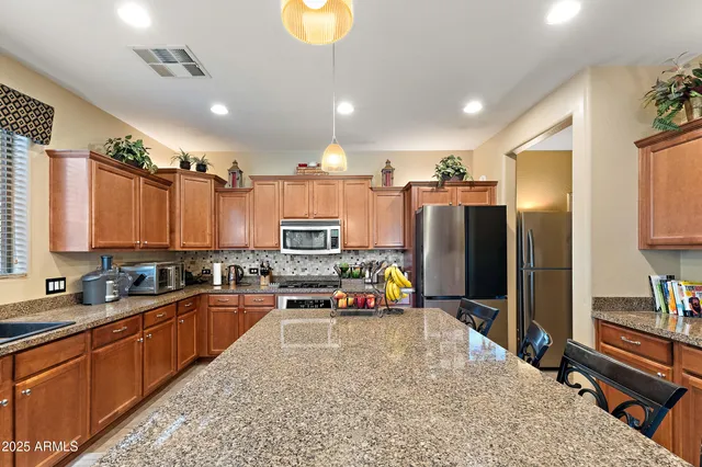 a view of a dining area with furniture and a chandelier
