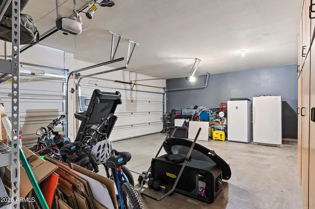 a view of a garage with rack and bicycle