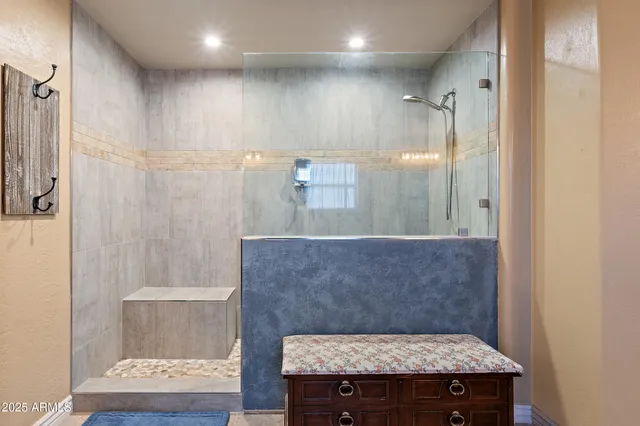 a view of two sink a large mirror and a lamp