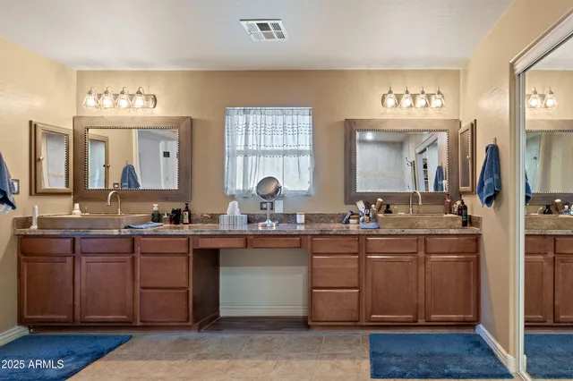 a view of walk in closet with clothes