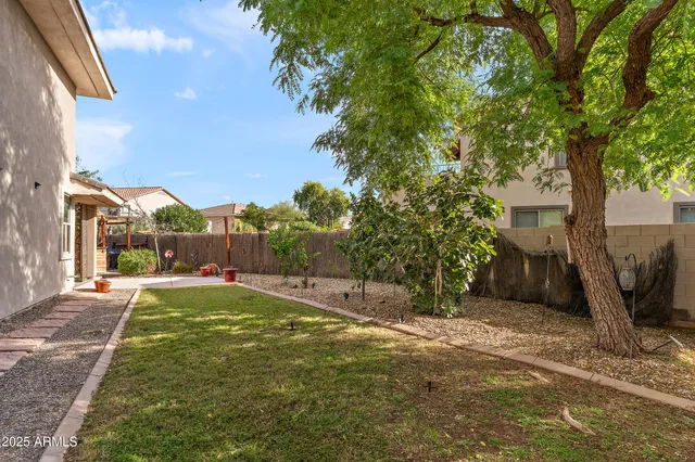 a backyard of a house with lots of green space