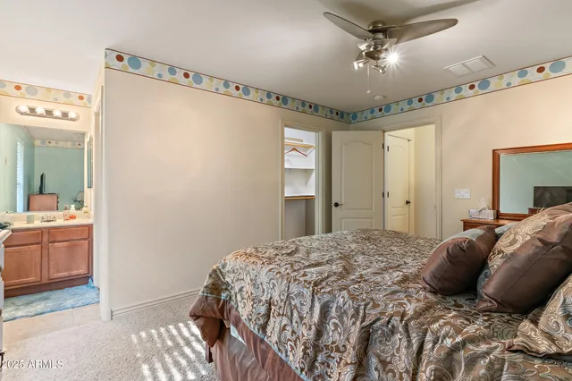 a white toilet sitting next to a bathroom sink