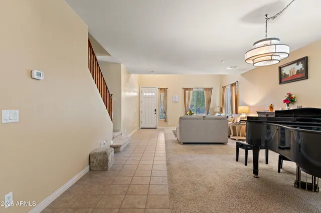 a room with furniture pool table and flat screen tv