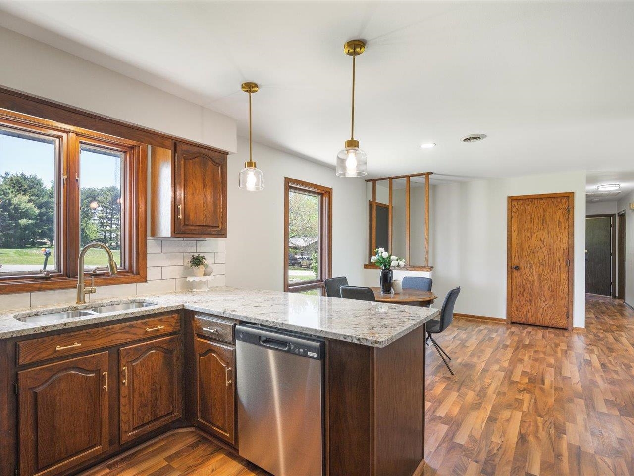 136 Lake Summerset Road Lake Summerset, IL 61019 - Photo 7 of 47 a kitchen with granite countertop a sink a counter top space and cabinets
