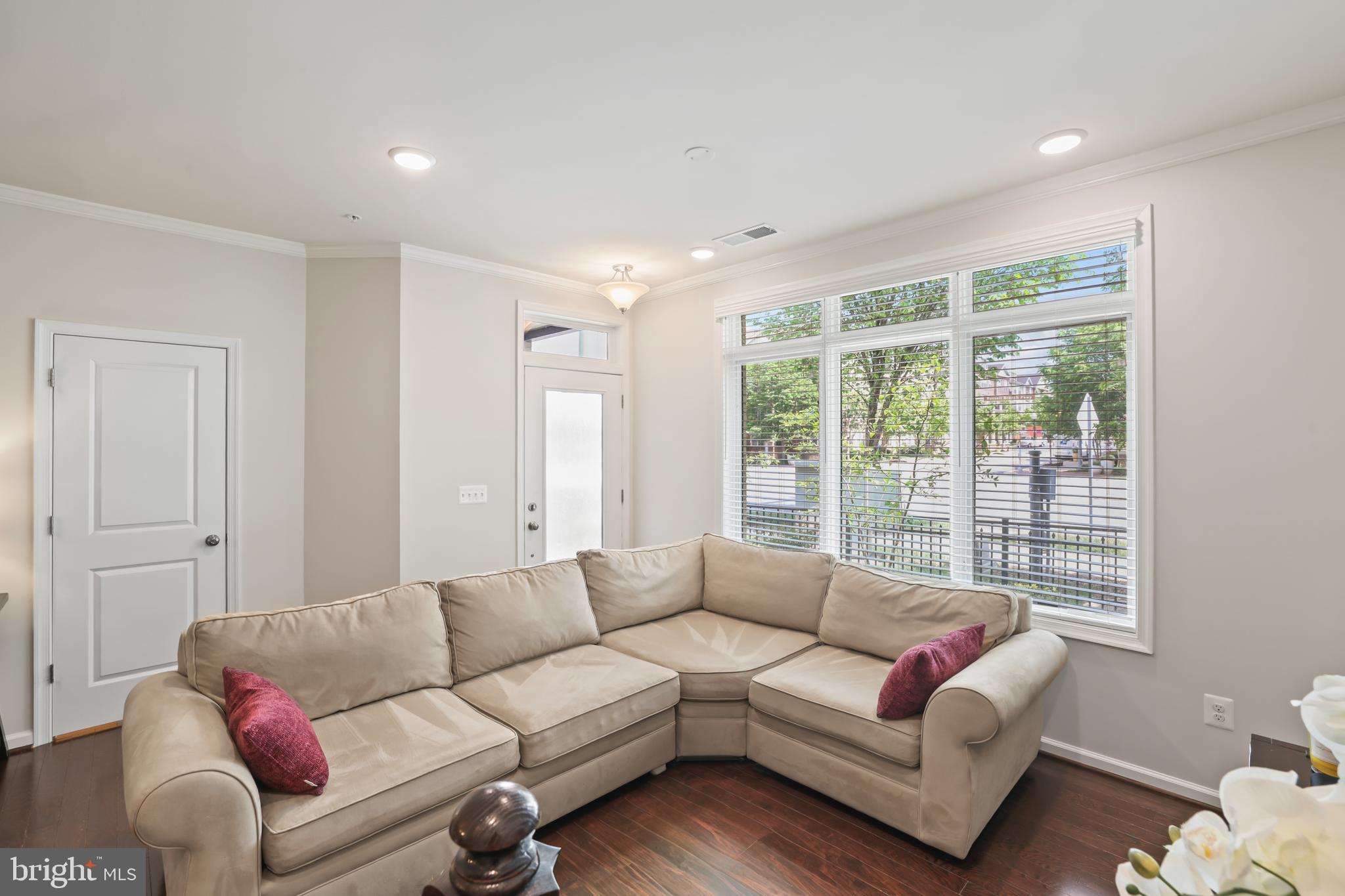 1102 Ribbon Limestone Terrace Southeast Leesburg, VA 20175 - Photo 16 of 51 a living room with furniture and a large window