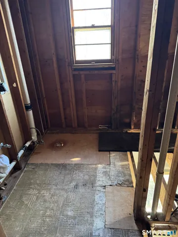 a bed room with furniture and a potted plant