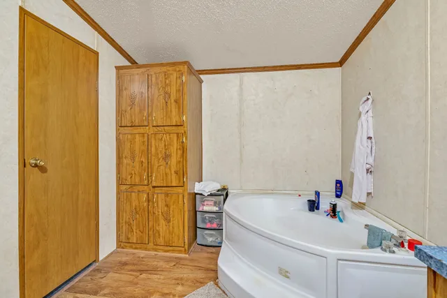 a bathroom with a bathtub and a shower