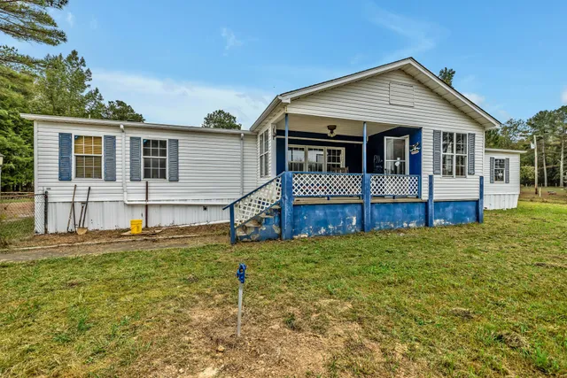 a front view of a house with yard