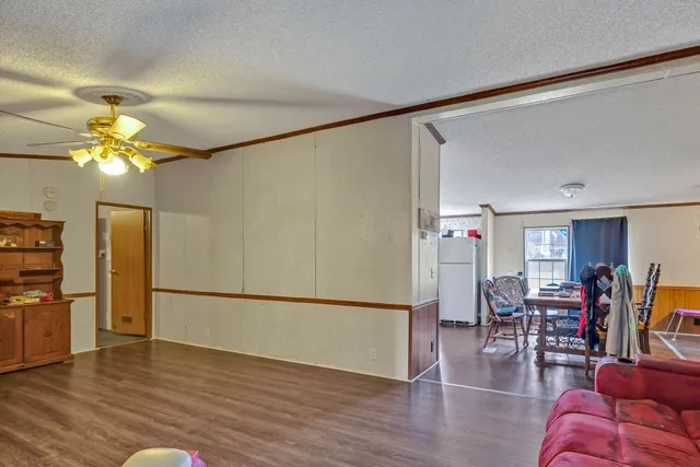 a view of a livingroom with furniture and wooden floor
