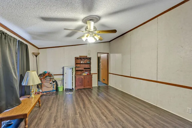 a view of a dining room with furniture wooden floor and chandelier