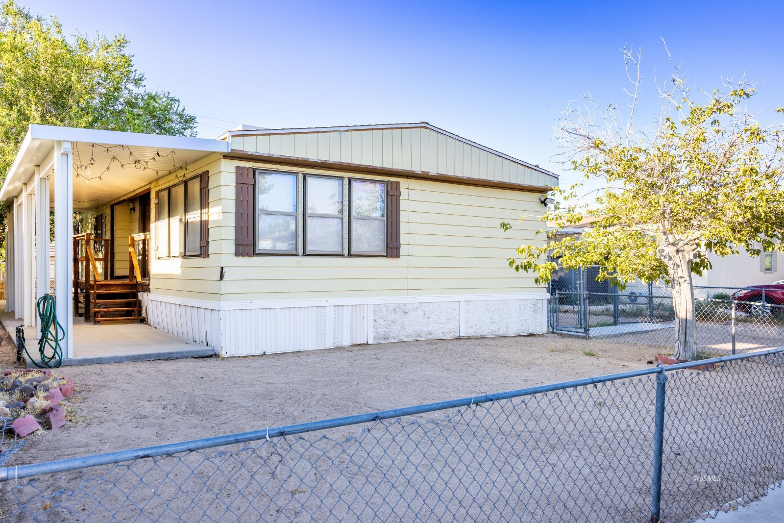 1428 West St George Avenue Ridgecrest, CA 93555 - Photo 1 of 30 a front view of a house with a yard