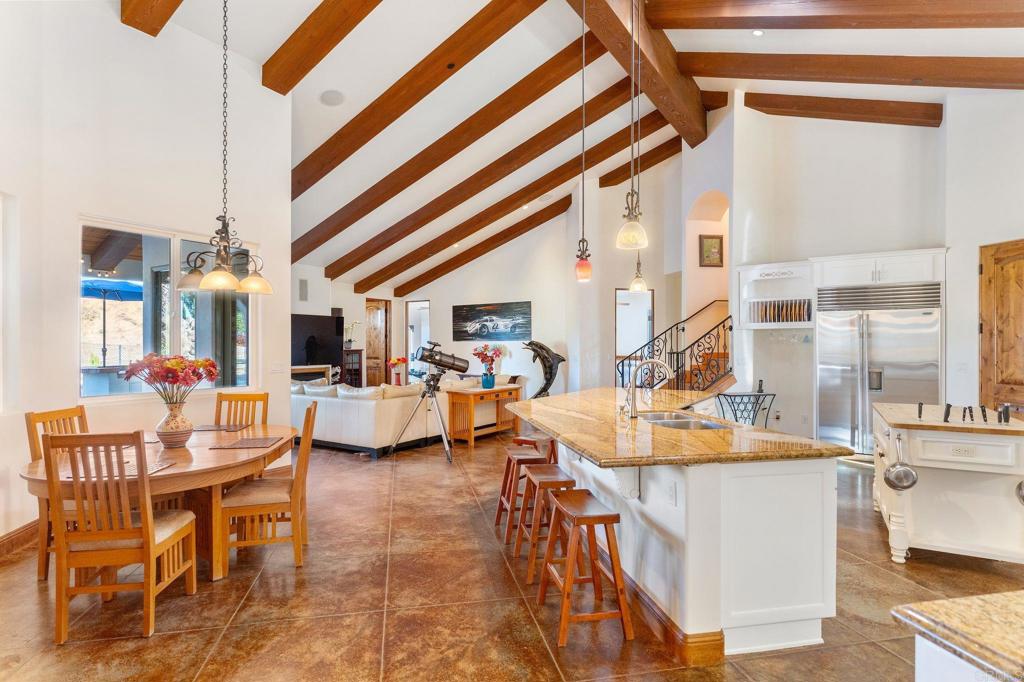 9746 Megan Escondido, CA 92026 - Photo 15 of 65 a dining room with furniture and a chandelier