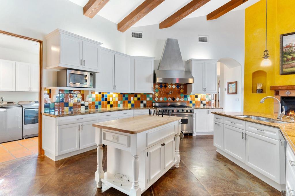 9746 Megan Escondido, CA 92026 - Photo 20 of 65 a kitchen with stainless steel appliances a stove a sink and a refrigerator