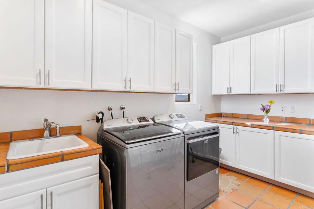 9746 Megan Escondido, CA 92026 - Photo 30 of 65 a view of a kitchen with sink and cabinets
