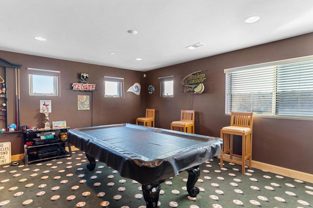 9746 Megan Escondido, CA 92026 - Photo 37 of 65 a living room with furniture a table and wooden floor