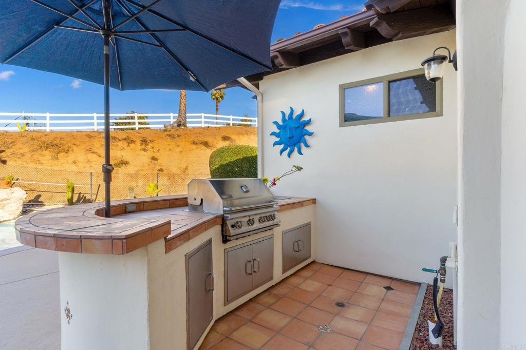 9746 Megan Escondido, CA 92026 - Photo 40 of 65 a kitchen with a stove and a microwave