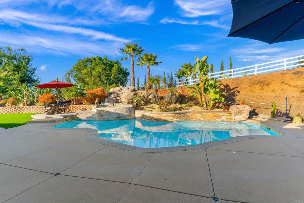 9746 Megan Escondido, CA 92026 - Photo 42 of 65 a view of a swimming pool with a yard