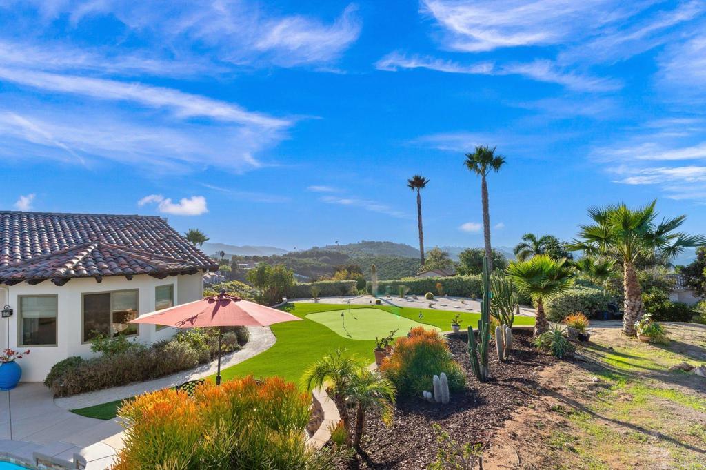 9746 Megan Escondido, CA 92026 - Photo 44 of 65 a view of a house with a backyard and a patio
