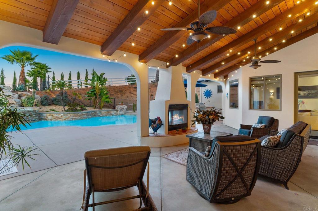 9746 Megan Escondido, CA 92026 - Photo 5 of 65 a living room with fireplace furniture and a potted plant