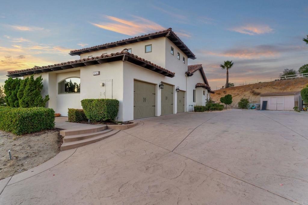 9746 Megan Escondido, CA 92026 - Photo 53 of 65 a front view of a house with a yard and garage