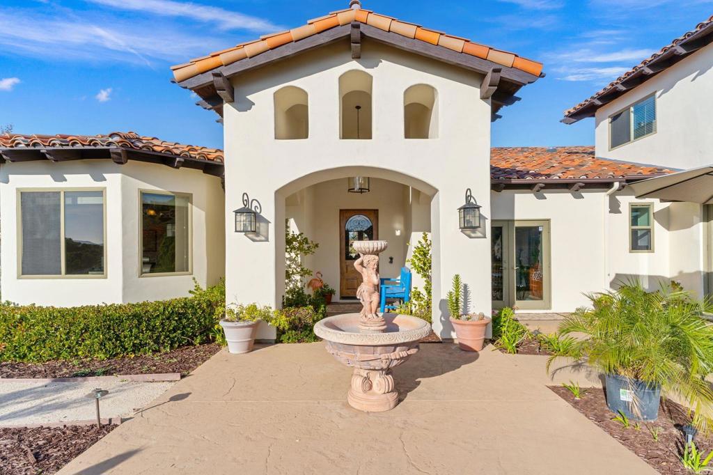 9746 Megan Escondido, CA 92026 - Photo 9 of 65 a front view of a house with a yard