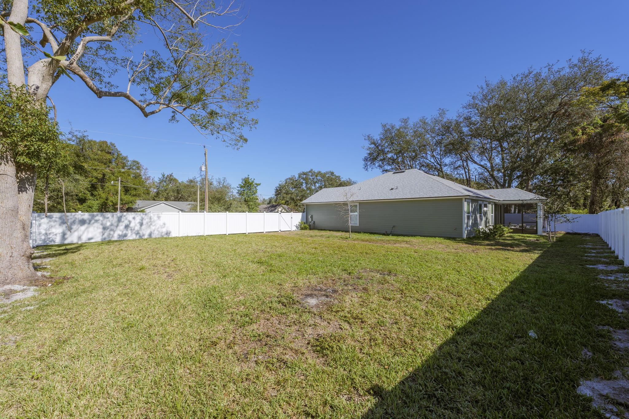 124 Swallow Road St. Augustine, FL 32086 - Photo 27 of 28 a front view of a house with a garden