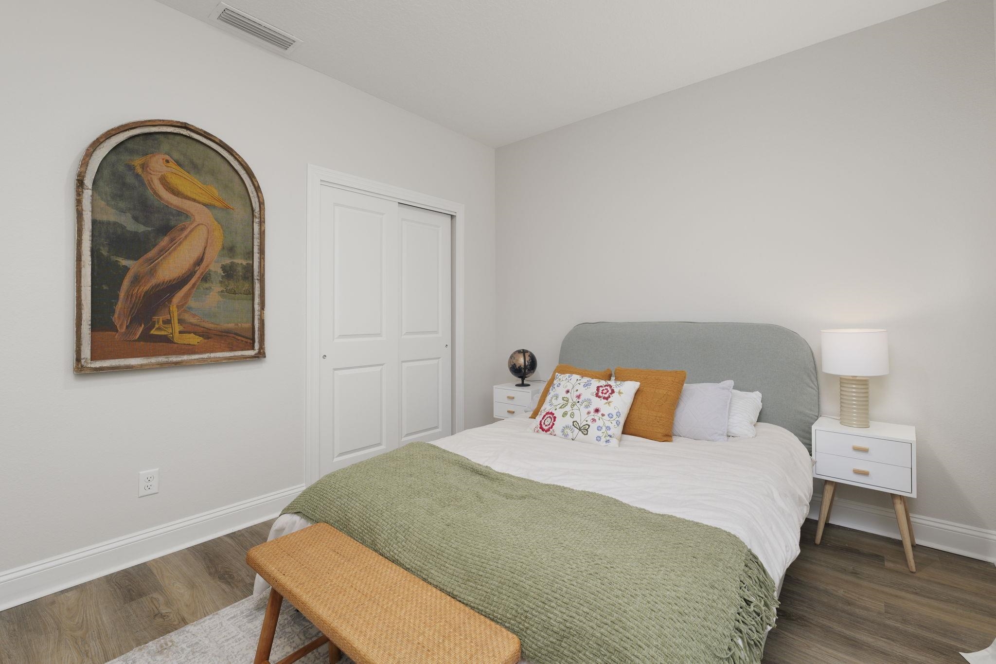 124 Swallow Road St. Augustine, FL 32086 - Photo 7 of 28 a bedroom with a bed and a painting on the wall