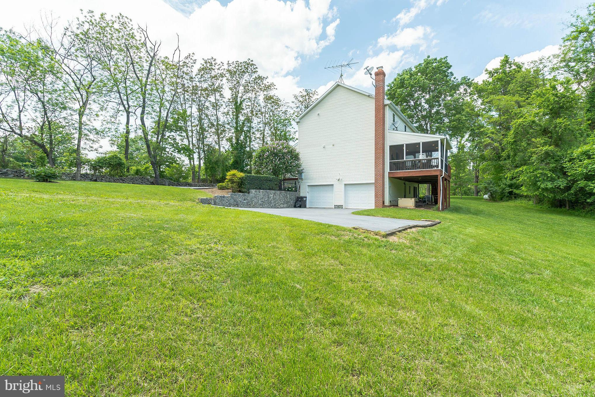 12888 Sagle Road Purcellville, VA 20132 - Photo 29 of 30 Surrounded by trees, stone walls, and lush yards